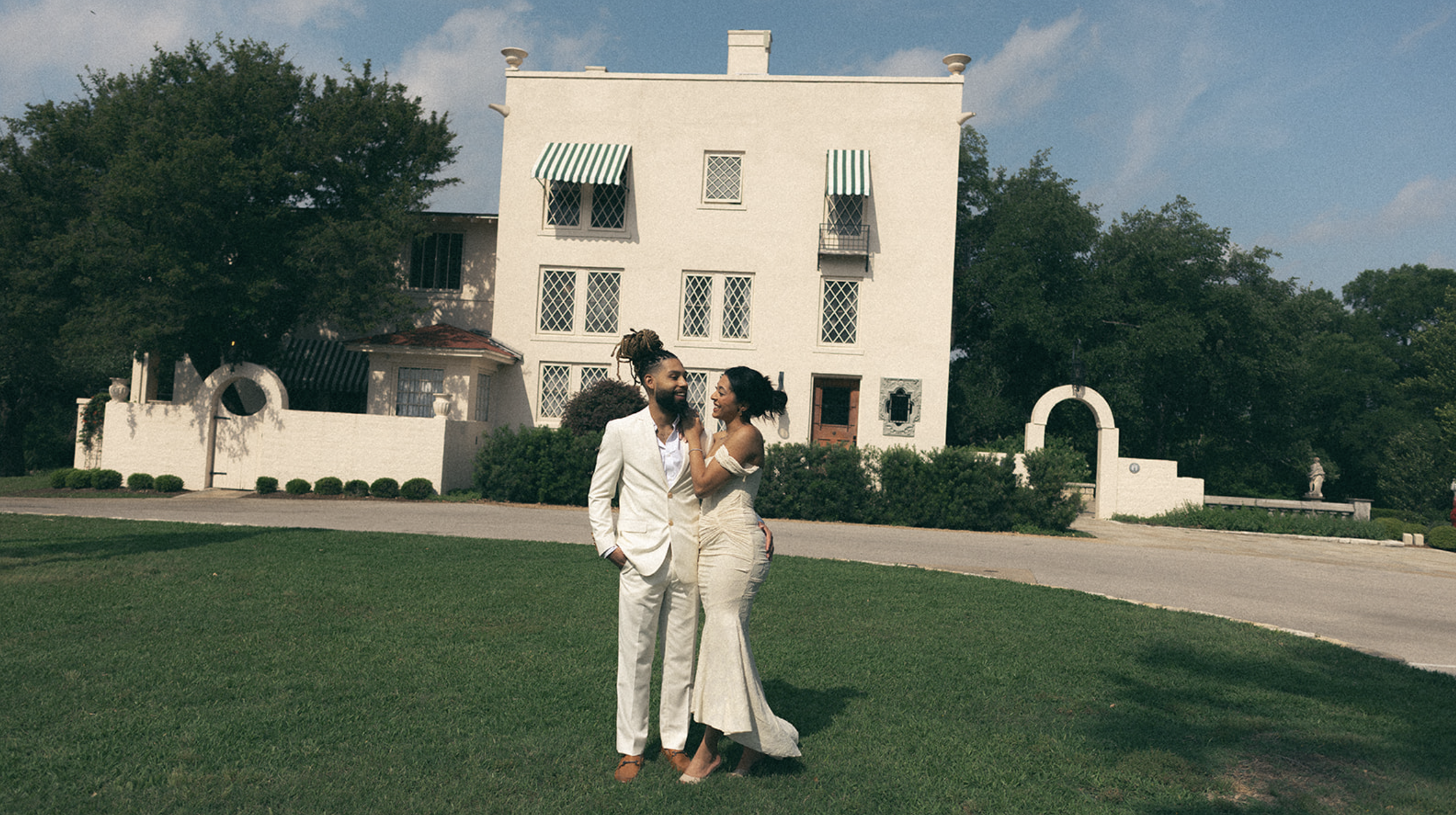 Engaged couple laughing and holding hands during their outdoor engagement session, captured by San Antonio wedding photographer Angie Rich.