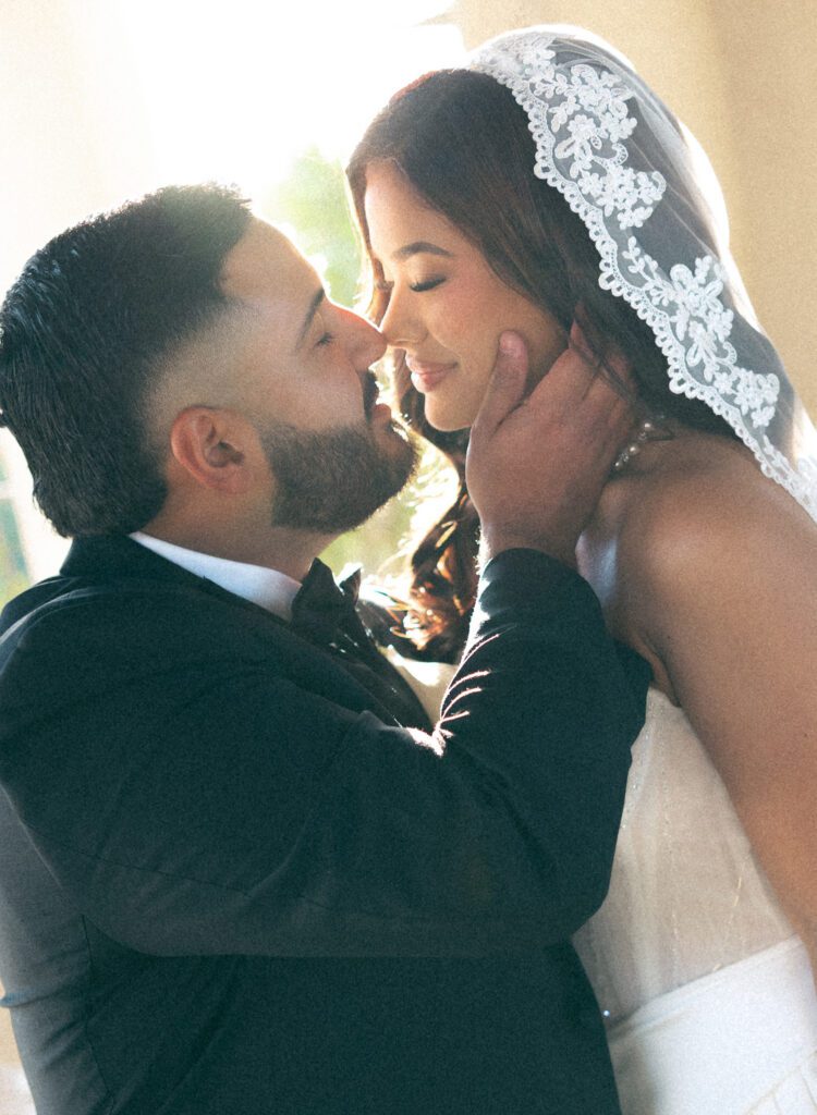 Romantic close-up of bride and groom sharing a kiss after their Chapel Dulcinea elopement ceremony.