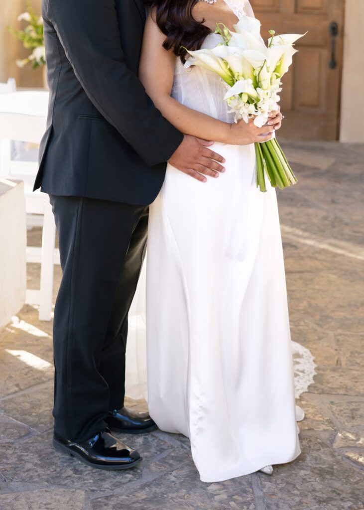 Close-up portrait highlighting the bride's bouquet and wedding dress during a Chapel Dulcinea elopement.