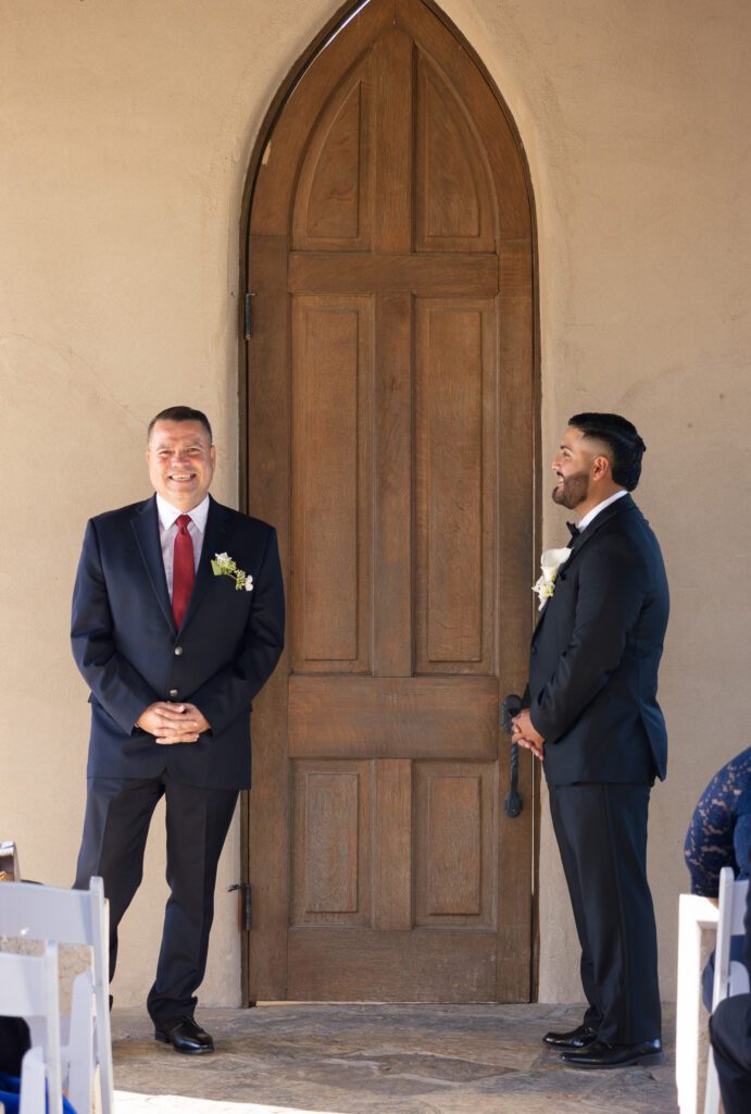 Groom waiting outside the chapel doors before the ceremony at Chapel Dulcinea in Austin, Texas.