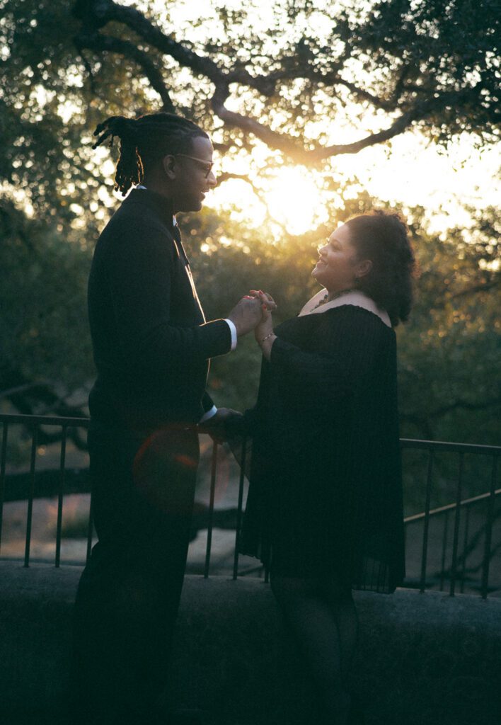 35mm film image of a couple sharing a sunset moment at Lost Mission wedding venue near San Antonio, photographed by Angie Rich Photography during an anniversary session.